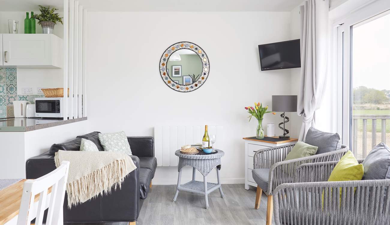 Your lovely lounge space looks towards your outside terraces and nature reserve beyond. 