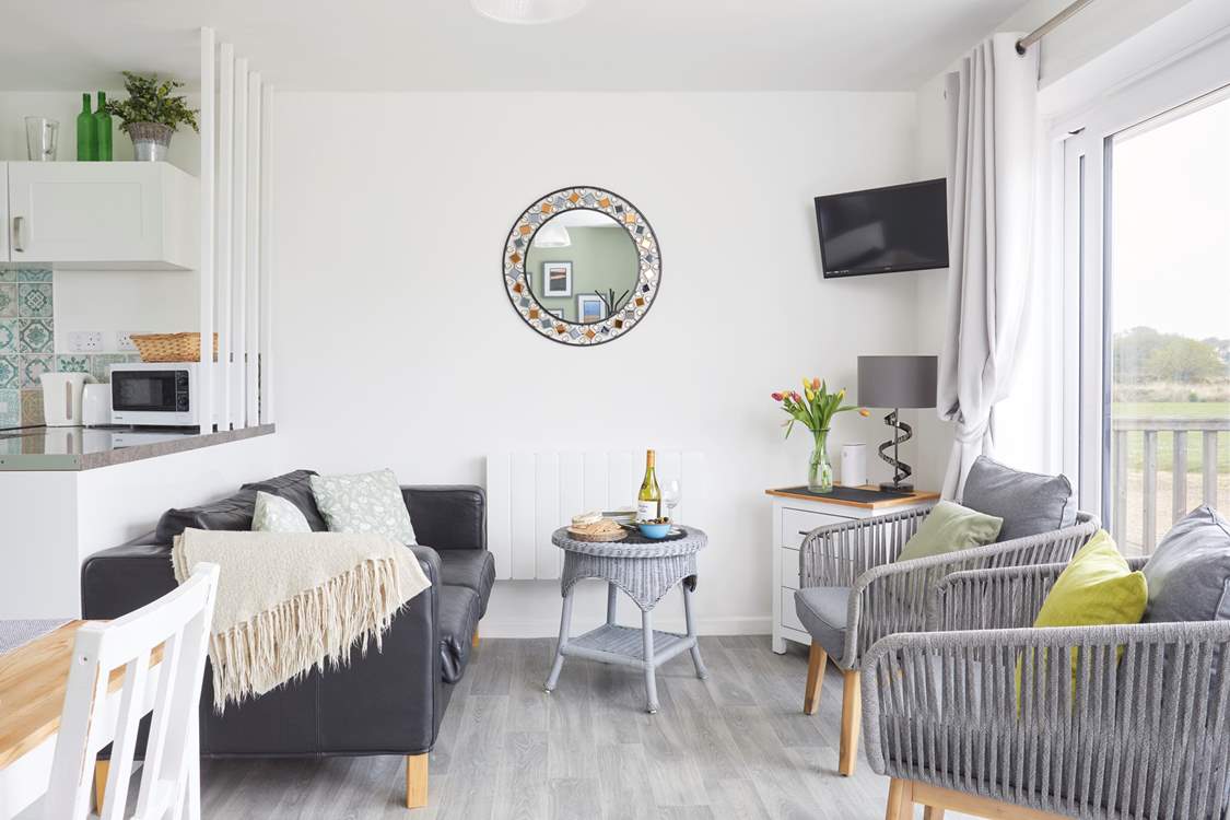 Your lovely lounge space looks towards your outside terraces and nature reserve beyond.