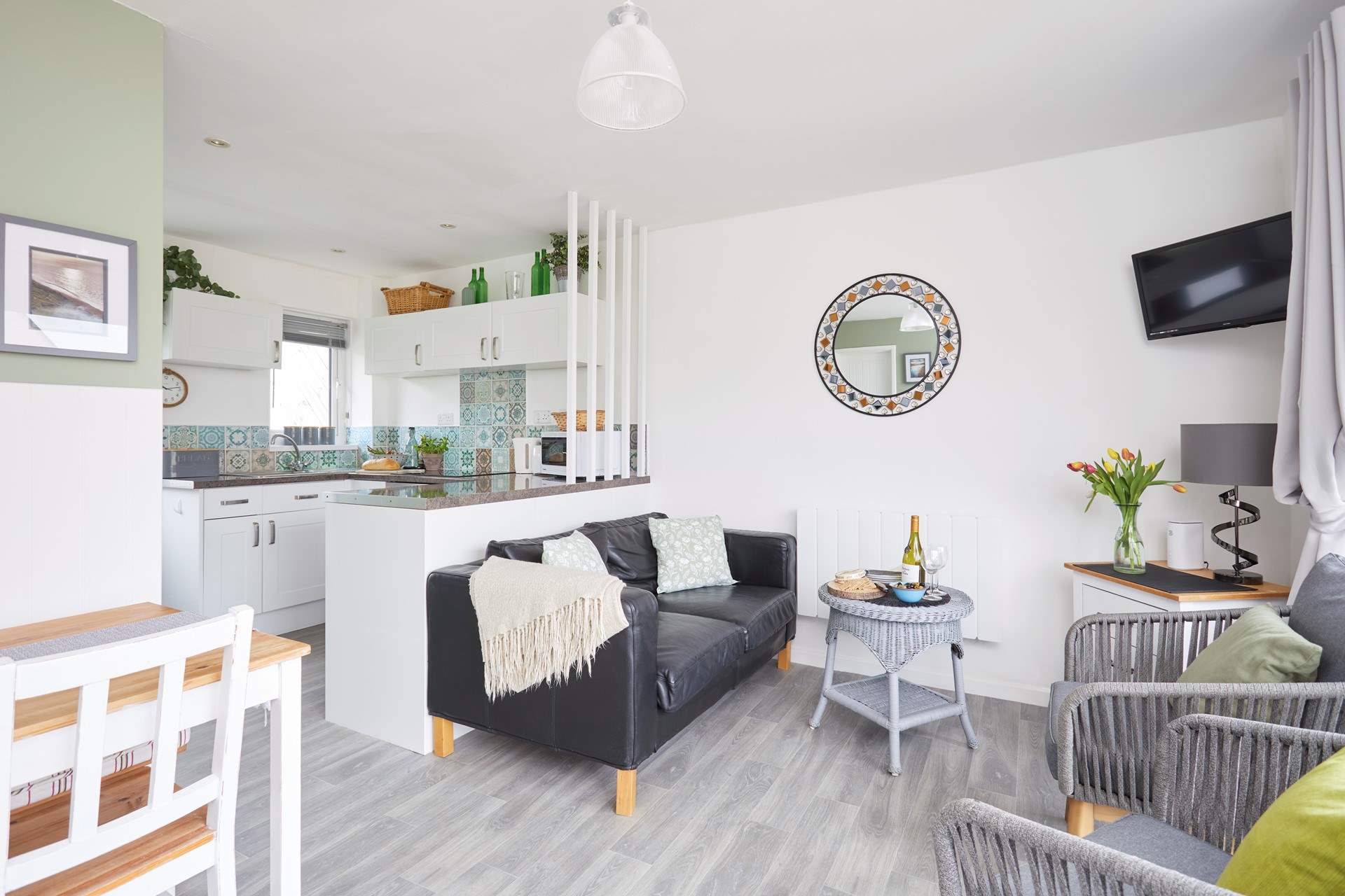 The living space is light and bright with patio doors to the front. 