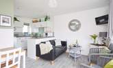 The living space is light and bright with patio doors to the front.  - Thumbnail Image