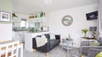 The living space is light and bright with patio doors to the front. 