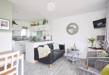 The living space is light and bright with patio doors to the front. 