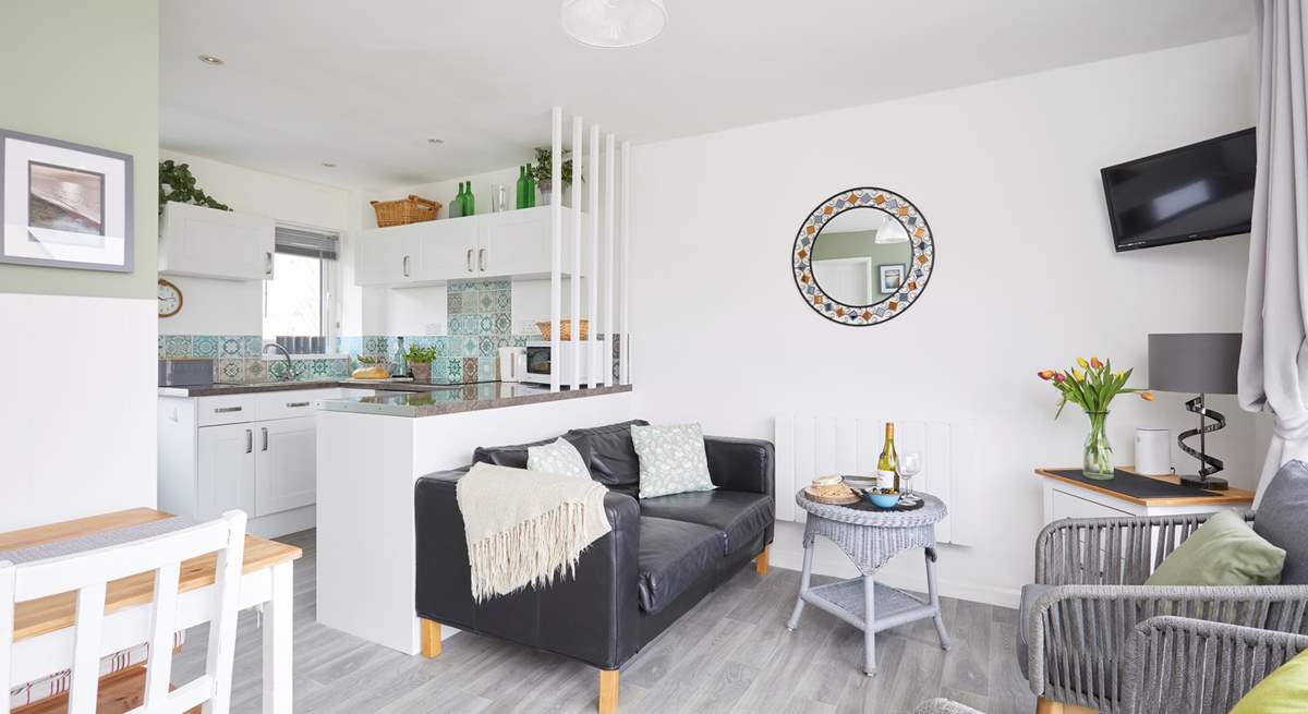 The living space is light and bright with patio doors to the front. 