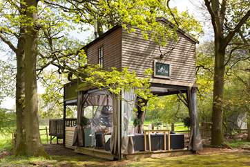 Directly under the treehouse, you will find your quirky living space. If the weather isn't so kind pull across the transparent canopy to keep cosy.