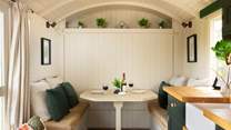 The queen-size (4') bed cleverly folds away, revealing a lovely dining area during the day. 