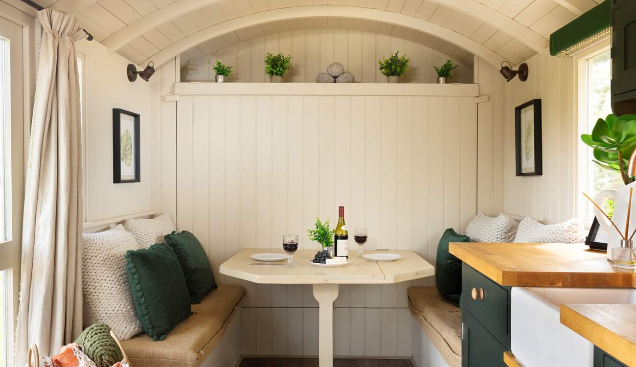 The queen-size (4') bed cleverly folds away, revealing a lovely dining area during the day. 