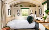 Emerald green tones create a calming atmosphere for your glamping getaway. - Thumbnail Image