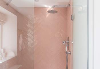 The en suite shower-room is pretty in pink.