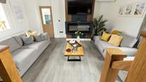 From the kitchen/dining area, step down into the comfy sitting-area.