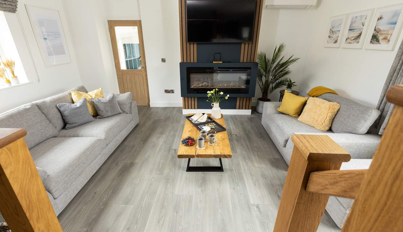 From the kitchen/dining area, step down into the comfy sitting-area.