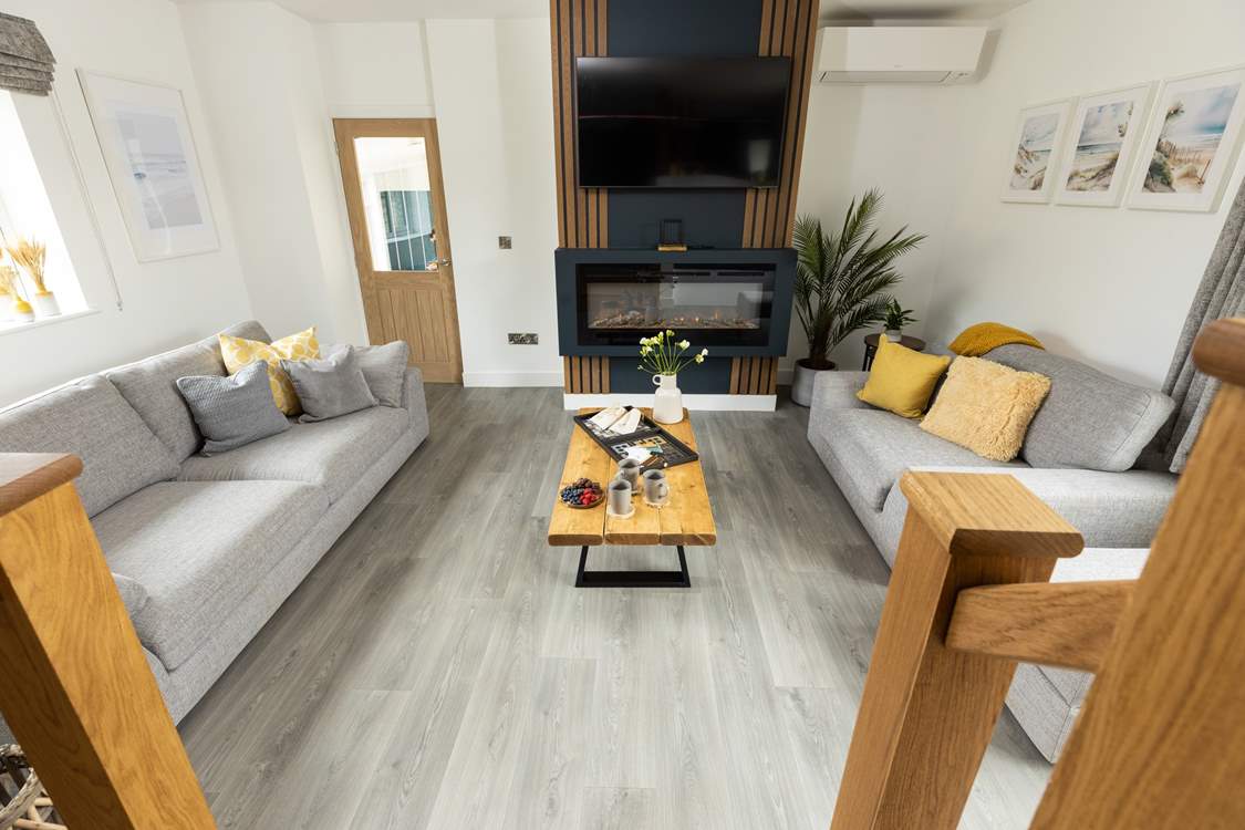 From the kitchen/dining area, step down into the comfy sitting-area.