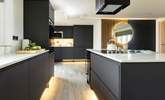 The kitchen island will delight the designated holiday chef. - Thumbnail Image