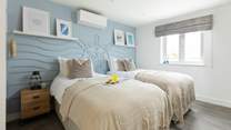 The nautically-themed Ocean bedroom with twin beds.