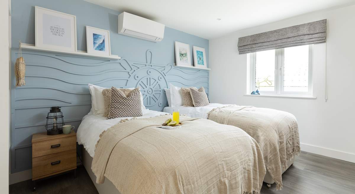 The nautically-themed Ocean bedroom with twin beds.