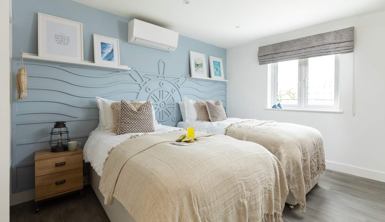 The nautically-themed Ocean bedroom with twin beds.