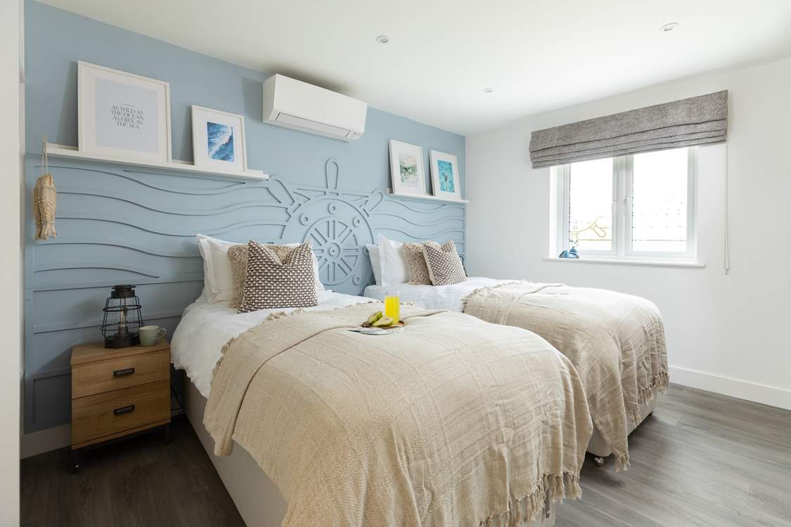 The nautically-themed Ocean bedroom with twin beds.