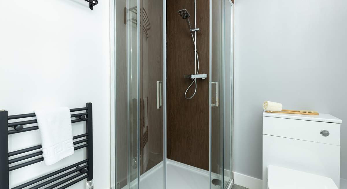 Each bedroom enjoys a modern en suite with a shower and heated towel rail.