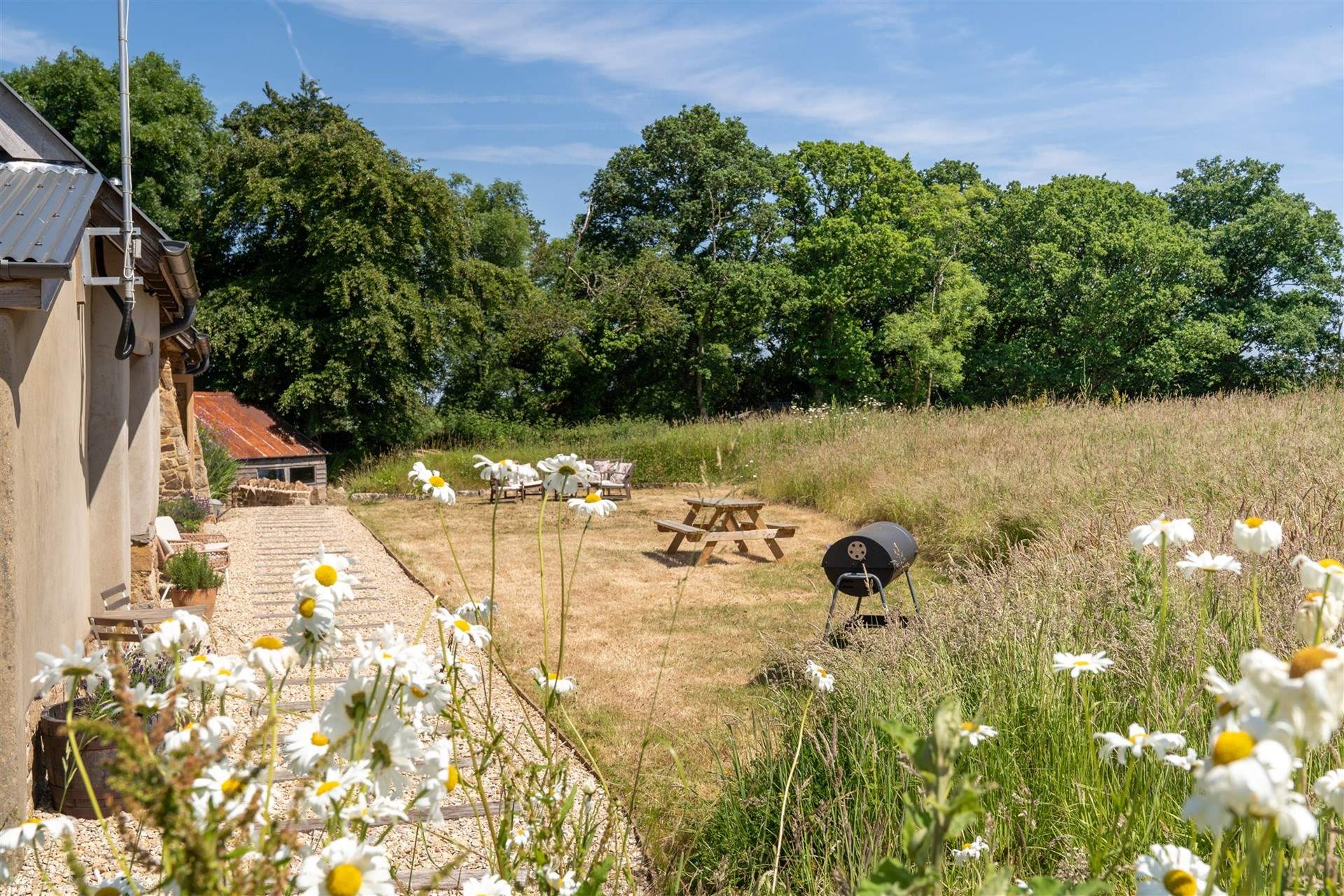 Wonderful seating area nestled amongst the wildlife and wildflowers.