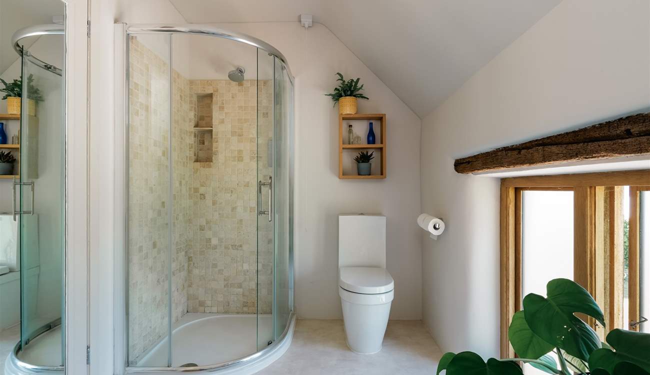 The family bathroom is equipped with a shower cubicle.