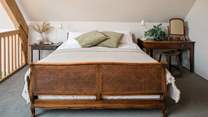 Bedroom three is on the mezzanine level. Please be mindful of the sloping ceiling.