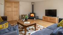 The cosy living area is fully equipped with wood-burner.