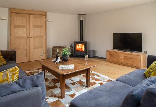 The cosy living area is fully equipped with wood-burner.