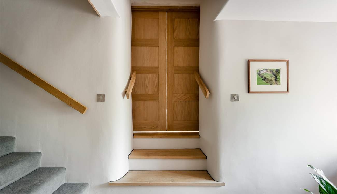 Go through the living room doors, down three steps and you are on the lower ground floor, where you will find bedroom one.