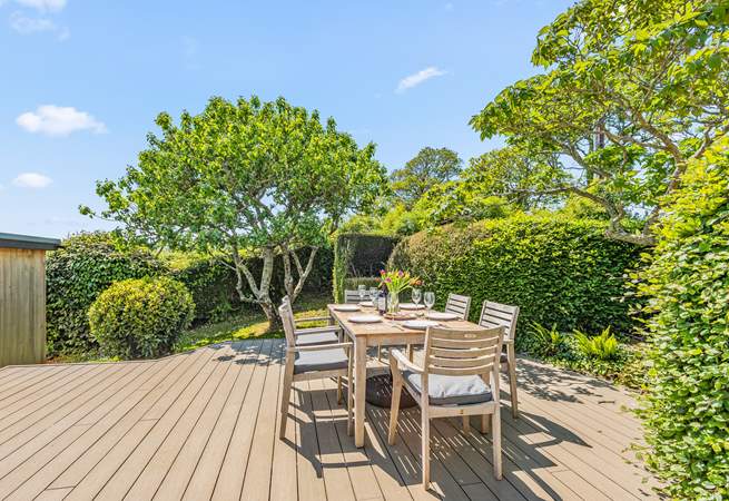 The decked area is perfect for gathering to dine al fresco and enjoy the fresh coastal air.