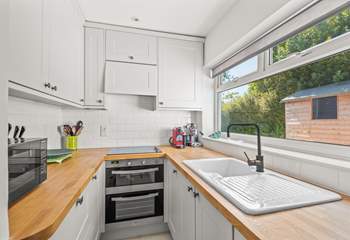 Neat and fully equipped cooking area.