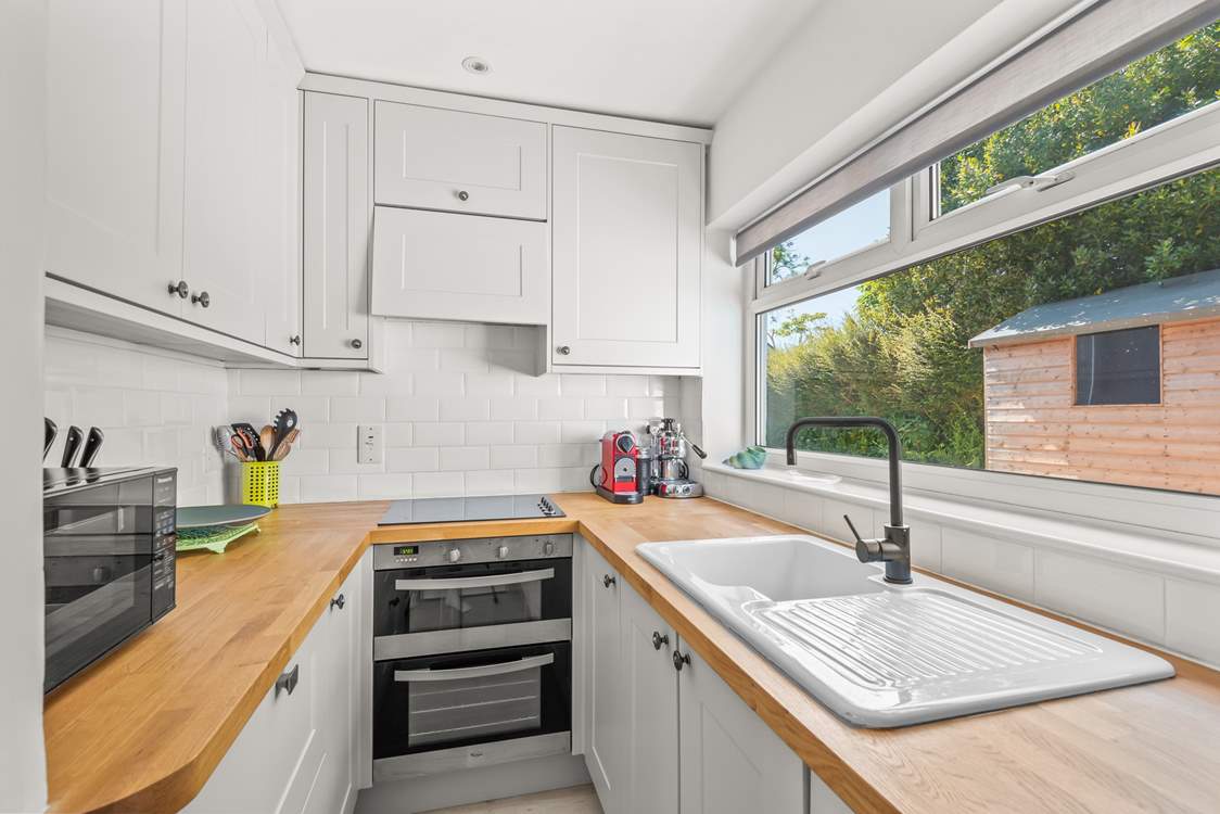 Neat and fully equipped cooking area.