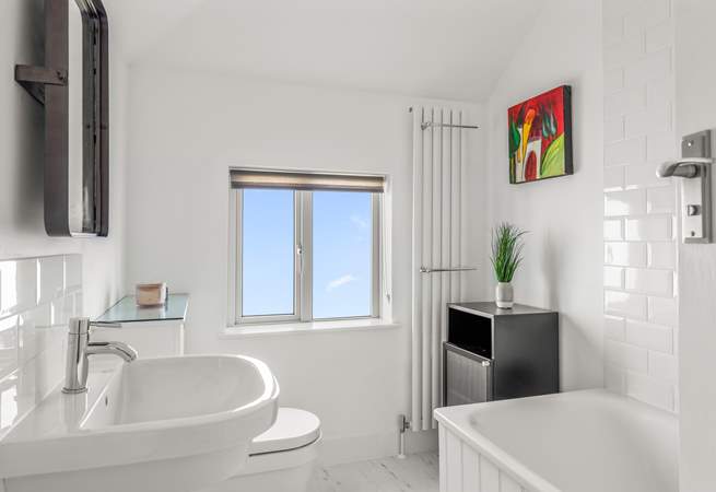 The fabulous family bathroom also offers a fitted shower.