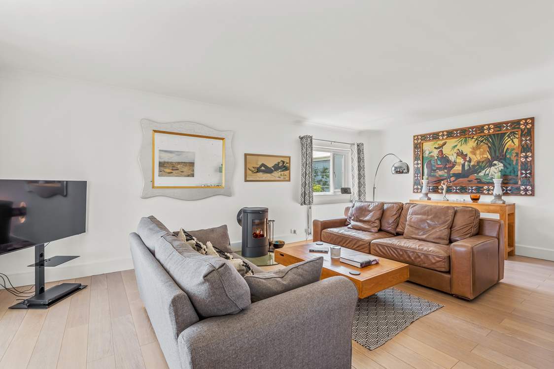 Large TV on hand and glowing woodburner on standby for those family movie nights.