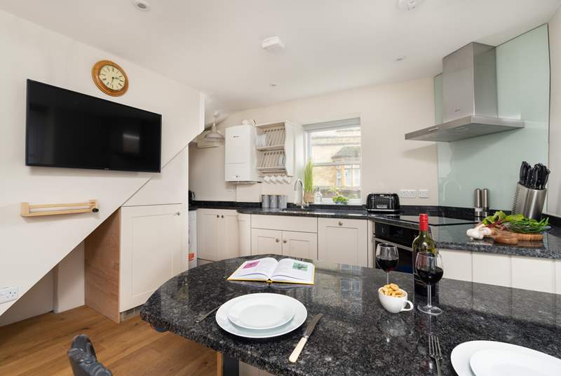 A charming open plan kitchen and living space, where you will find everything you need for a self-catered stay.