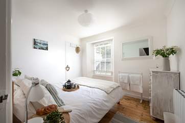 Cool shades in the pretty bedrooms.