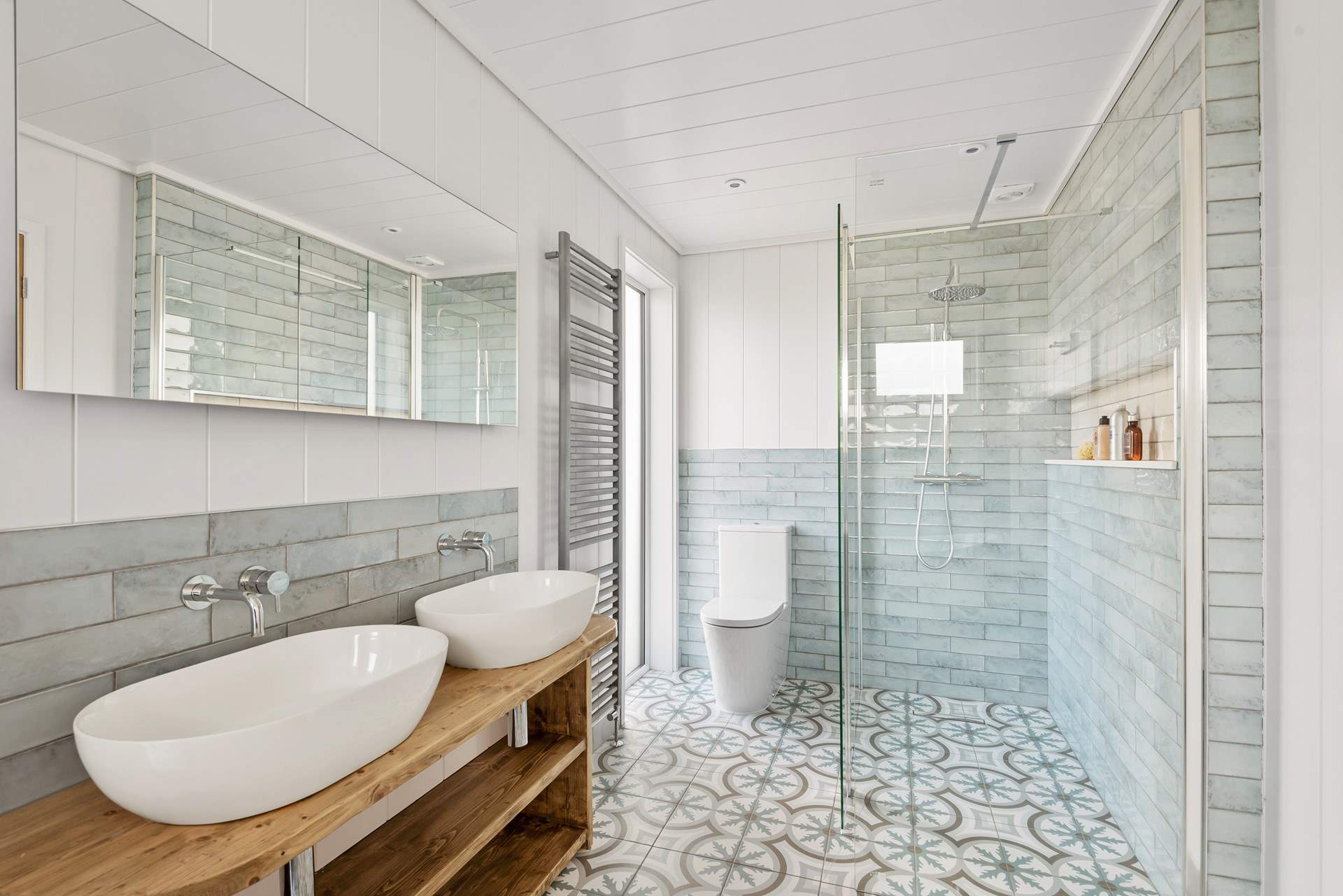 The fabulous bathroom has a gorgeous walk-in shower as well as the free-standing bath.
