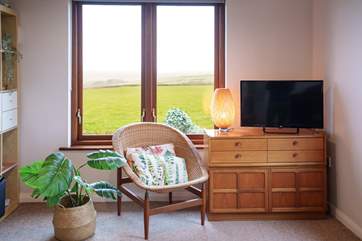 Take time out with your favourite book in the second sitting-room. Look at those views!