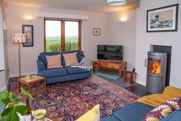 The warming wood-burner will keep you cosy throughout the year.