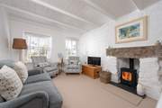 The cosy sitting-room has a wood-burner to keep you warm whatever the weather. 