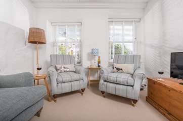 Beautiful furnishings marry seamlessly with traditional cottage features here.
