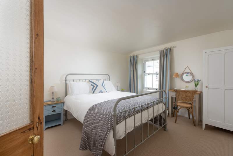 The first floor bedroom has a view over the green towards the estuary. Due to the steepness of the stairs, we would not recommend carrying your infant to this room.