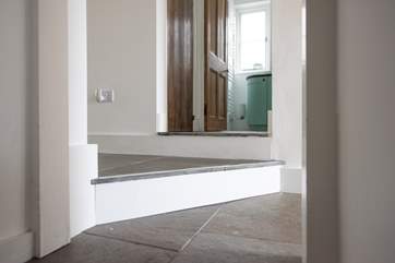 These steps are on the Ground floor and are between the bathroom, living space and bedroom 1. They are unique, at an angle and varying depths. Take very great care.