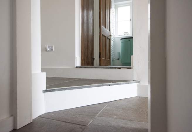 These steps are on the Ground floor and are between the bathroom, living space and bedroom 1. They are unique, at an angle and varying depths. Take very great care.