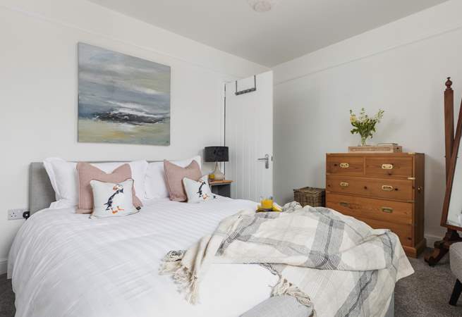 The bedrooms are stylishly furnished with comfort in mind. This is bedroom 1 and looks out over the front of the house.