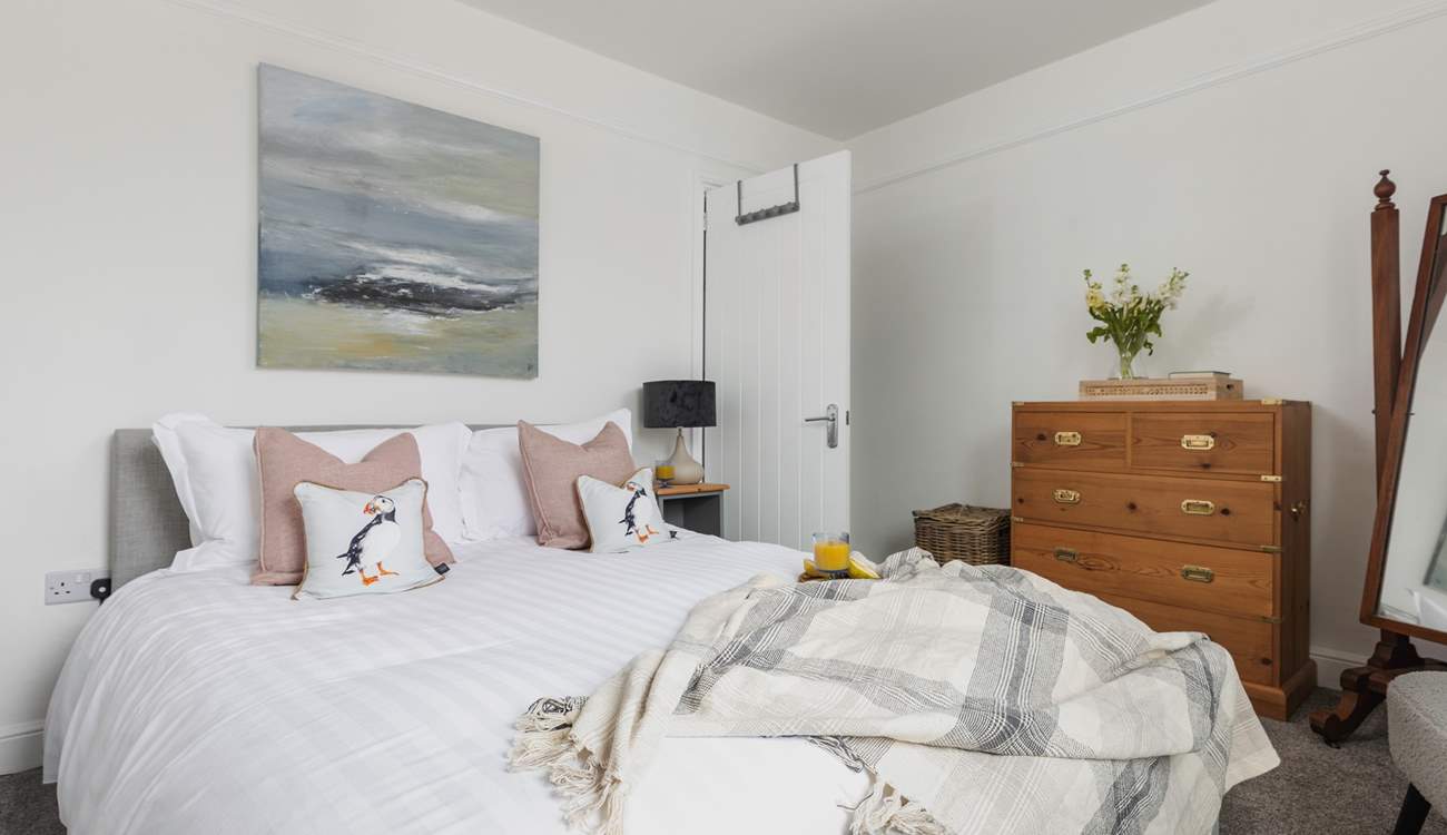 The bedrooms are stylishly furnished with comfort in mind. This is bedroom 1 and looks out over the front of the house.