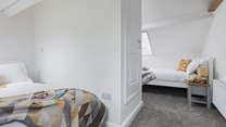 Bedroom 3 is the perfect hangout room offering two double beds and views across the rooftops.