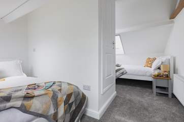Bedroom 3 is the perfect hangout room offering two double beds and views across the rooftops.