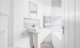 The ground floor bathroom is perfect for a long soak after a busy day. - Thumbnail Image