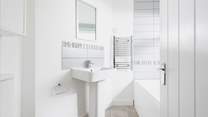 The ground floor bathroom is perfect for a long soak after a busy day.