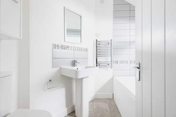 The ground floor bathroom is perfect for a long soak after a busy day.