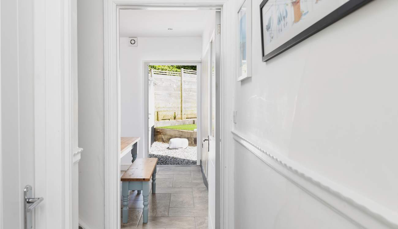 From the front door with the sitting-room on the left, stairs and the ktichen/diner.